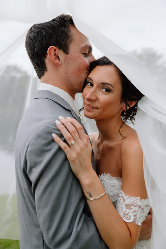 Watersedge wedding venue in Columbus, Ohio, under veil bride and groom