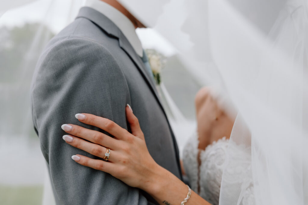 Watersedge wedding venue in Columbus, Ohio, under veil ring shot bride and groom