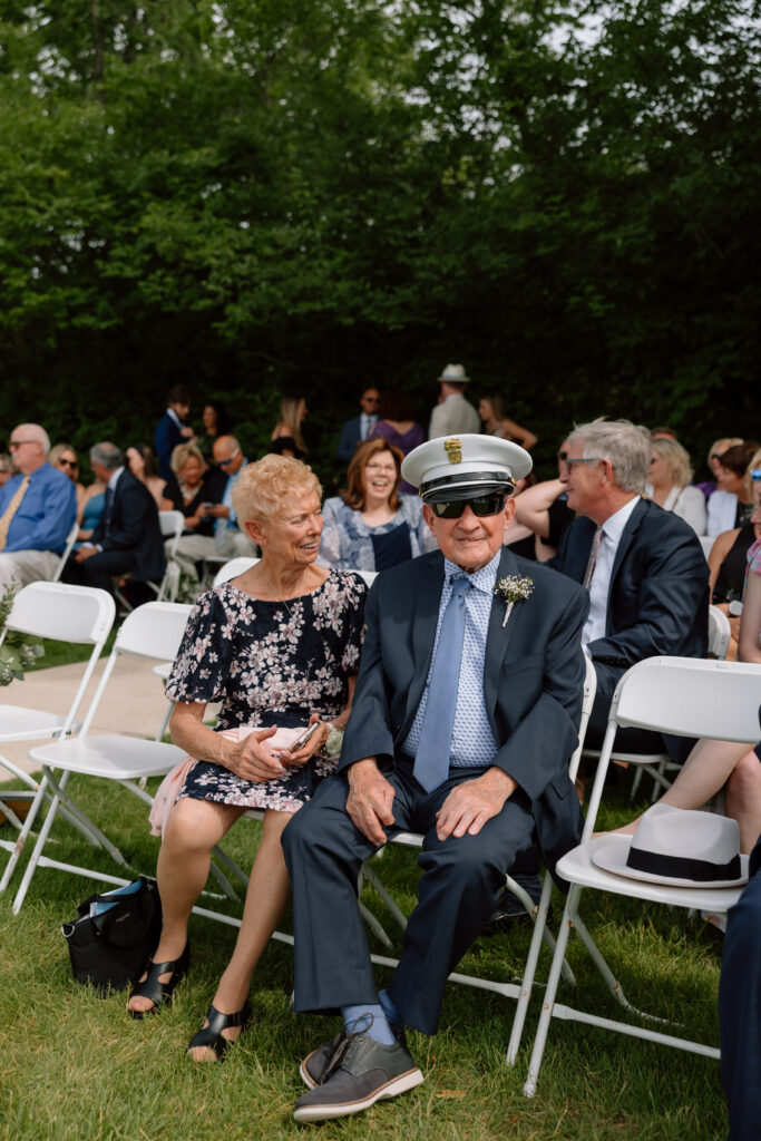 Watersedge wedding venue in Columbus, Ohio, photo of grandpa wearing a sailors hat at ceremony