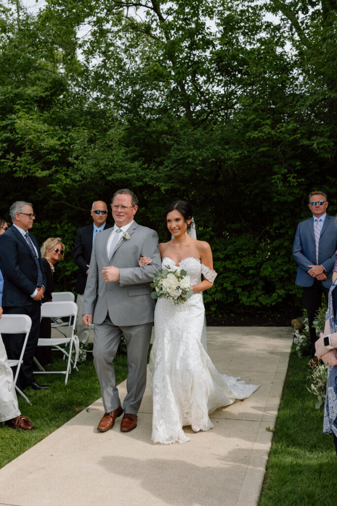 Watersedge wedding venue in Columbus, Ohio, bride walking down the aisle